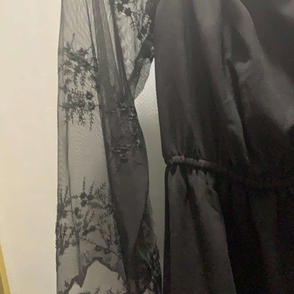 Black dress, long lace sleeve, dress is up to your knees